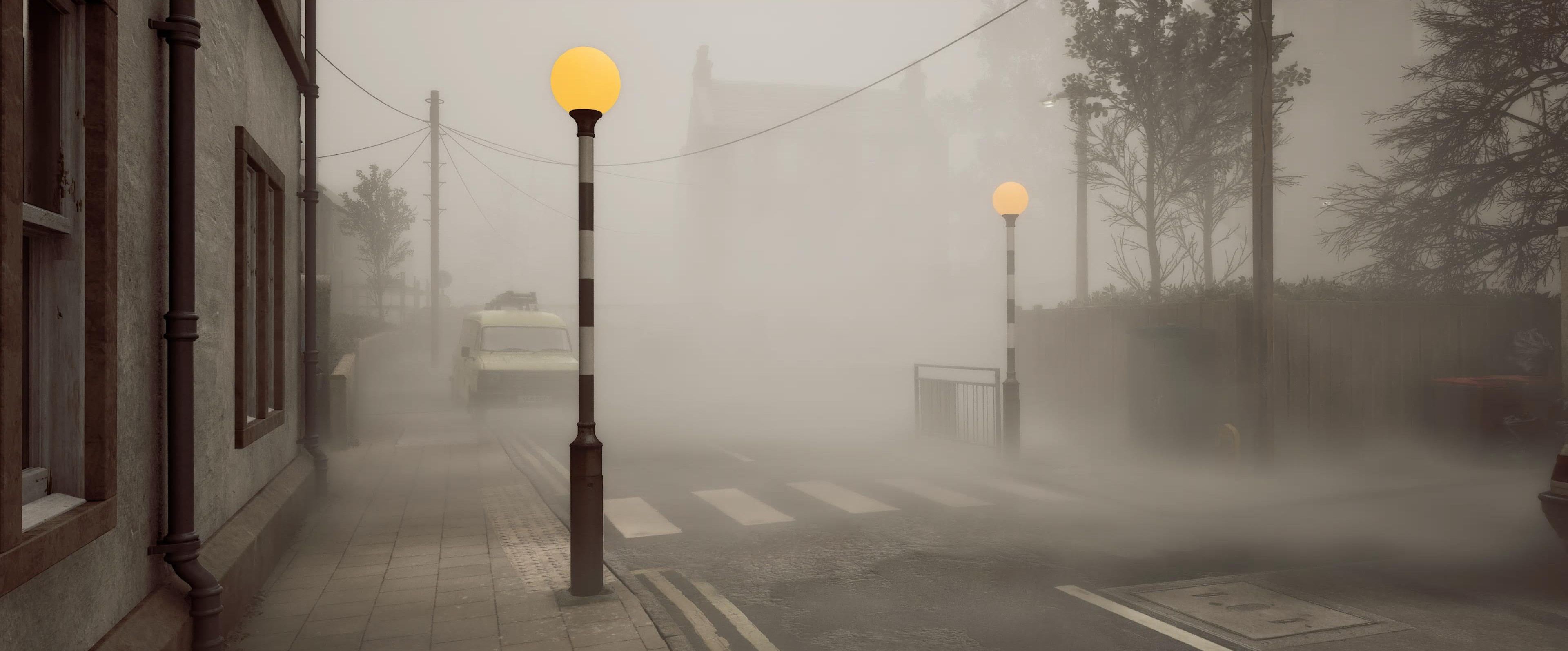 Two Belisha Beacons (striped poles with flashing amber lights on top), a zebra crossing, a road, lots of fog. it looks British and working class and also supremely isolating